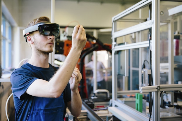 Man uses VR at work.